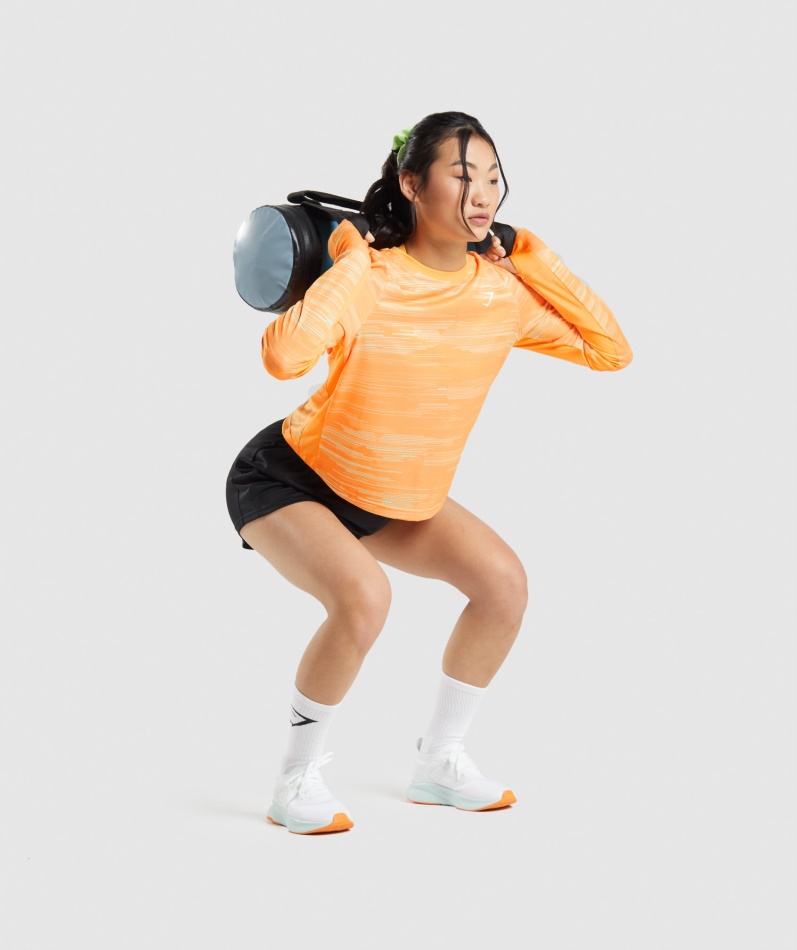 Gymshark Sport Løs Langermet T-skjorte Oransje Trykk